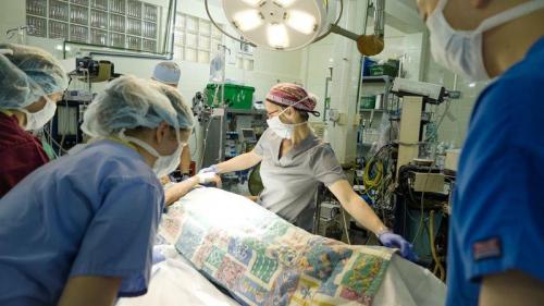 nurses with patient in recovery